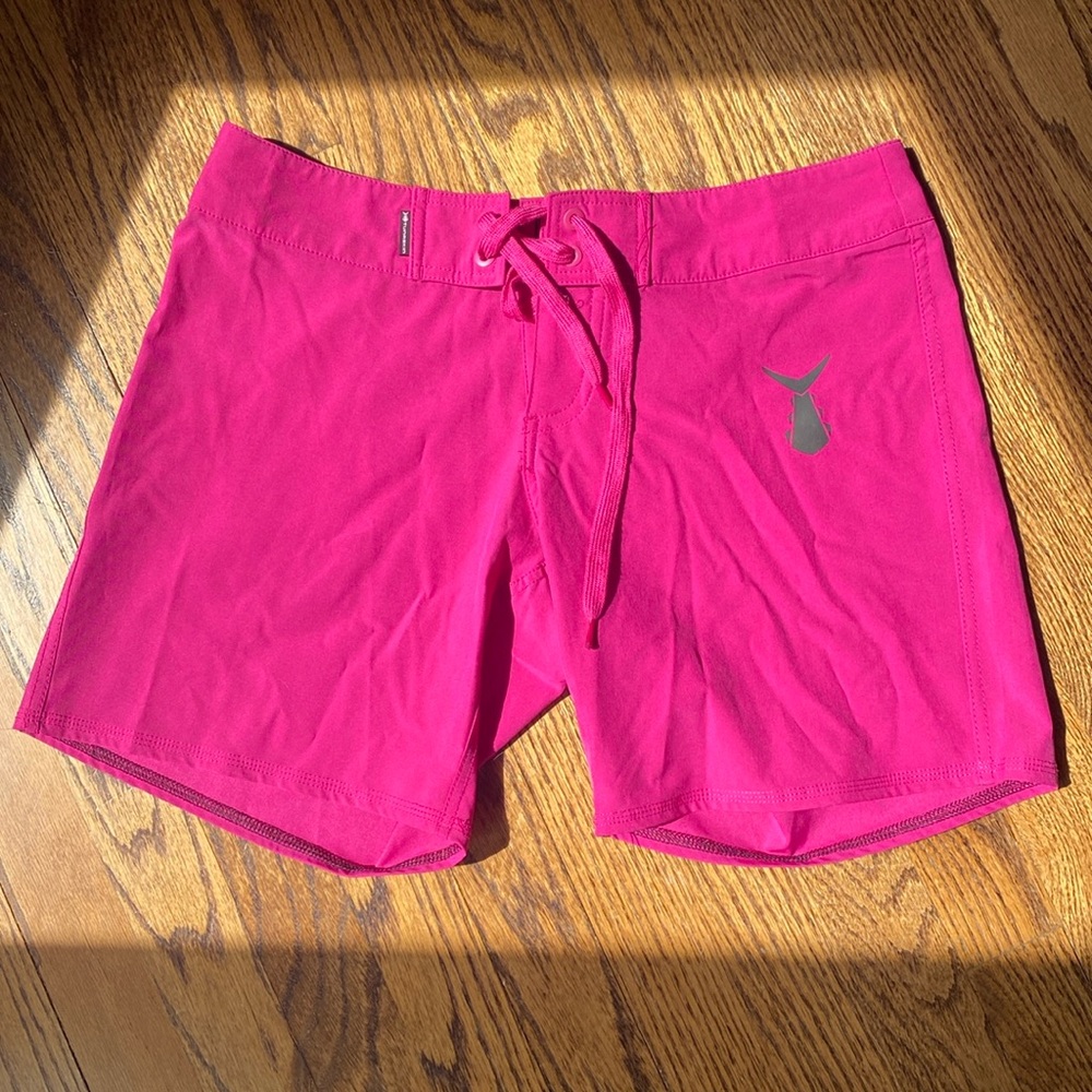 Tunaskin Bright Pink women’s board shorts.